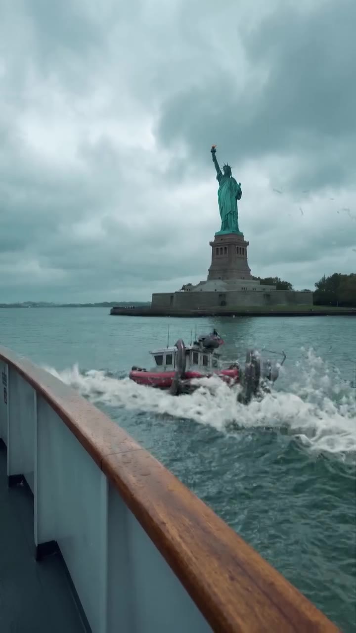 The patrol boat dragged through a wave of white water in front of Liberty Island