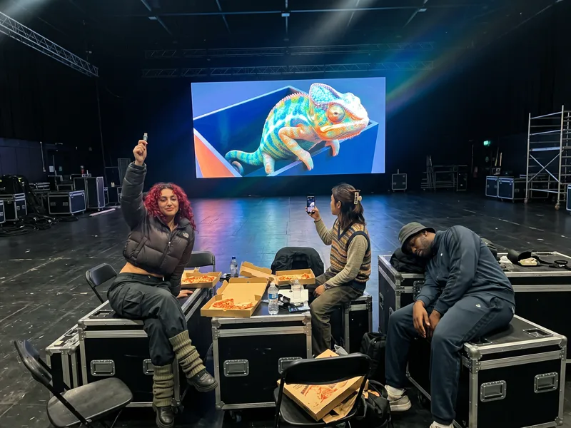 The night before the show, the team tests the film on the LED wall with a backup in hand